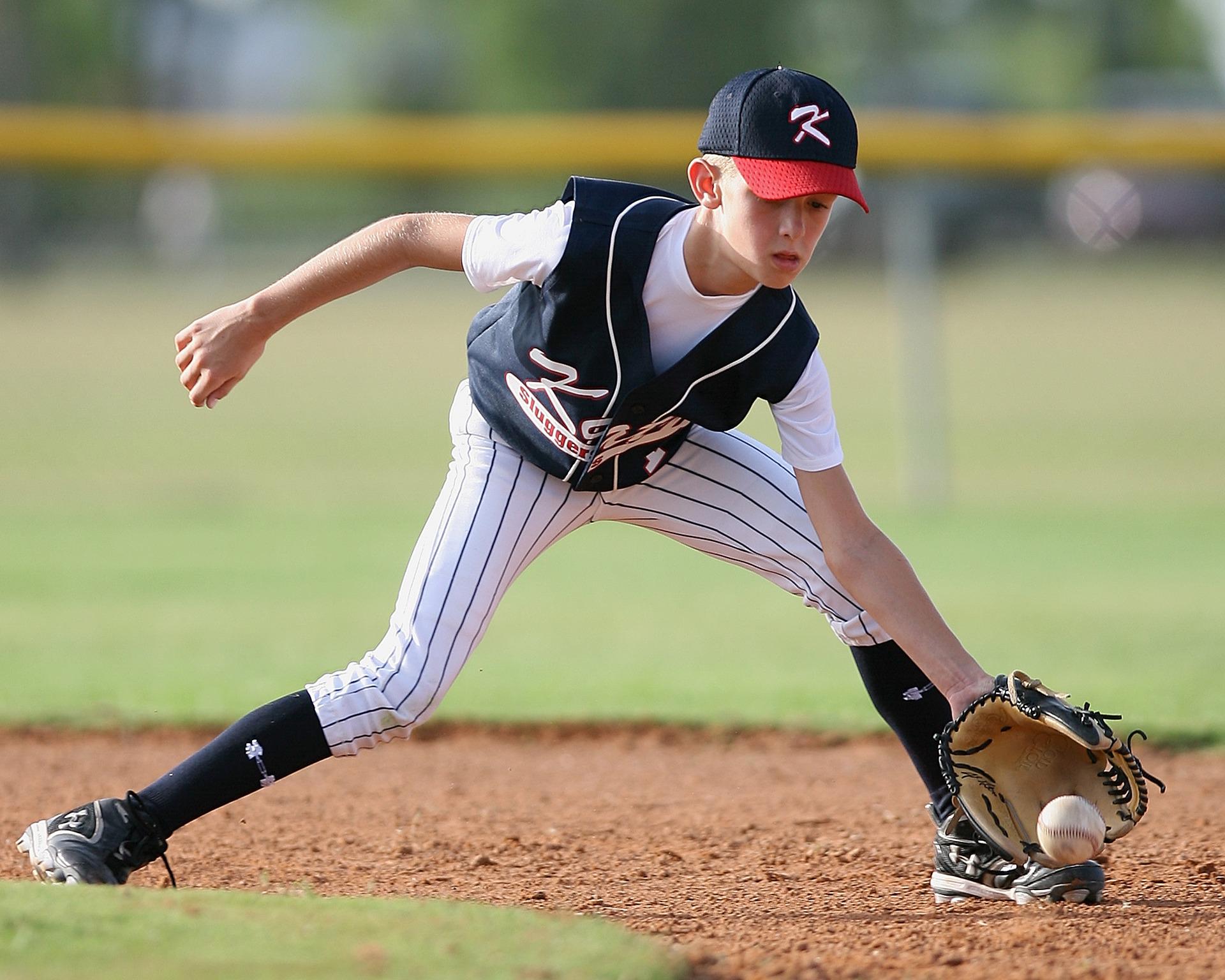 The Visual Aspects of Baseball | Little league baseball player fielding the ball | SureVision Eye Centers